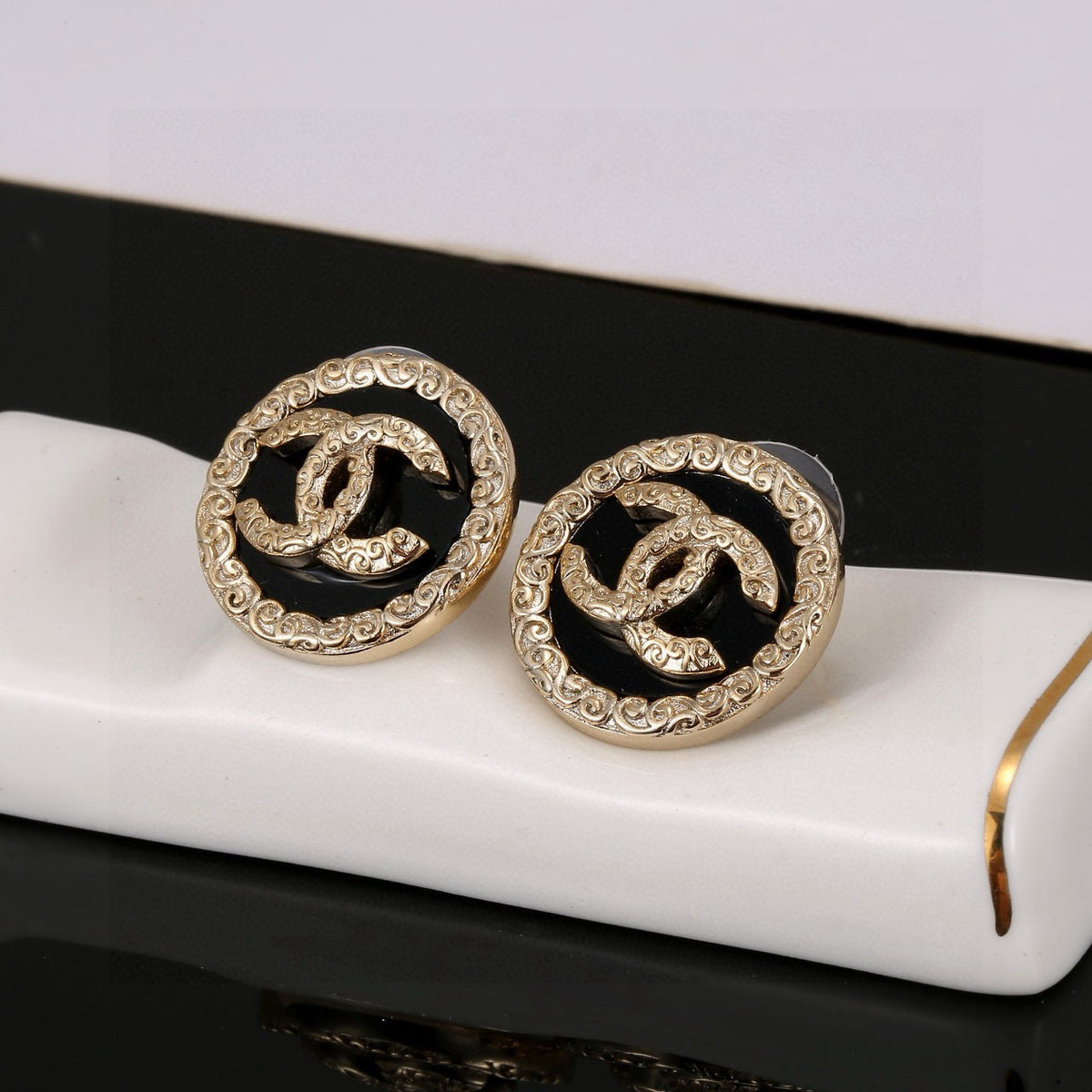 Chanel Interlocking C Black Circular Earrings - album image 1