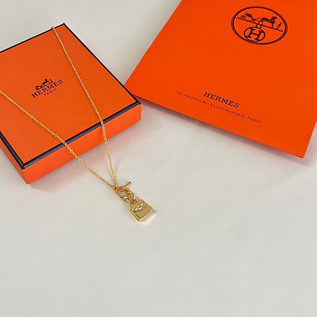 Hermès Gold-Tone Rectangular Tag Pendant Necklace - album image 1