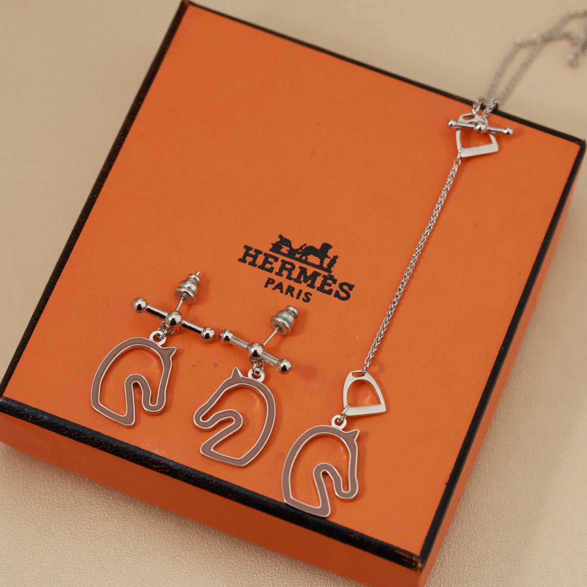 Hermès Horse-Outline Stud Earrings in Three Metal Tones - album image 1