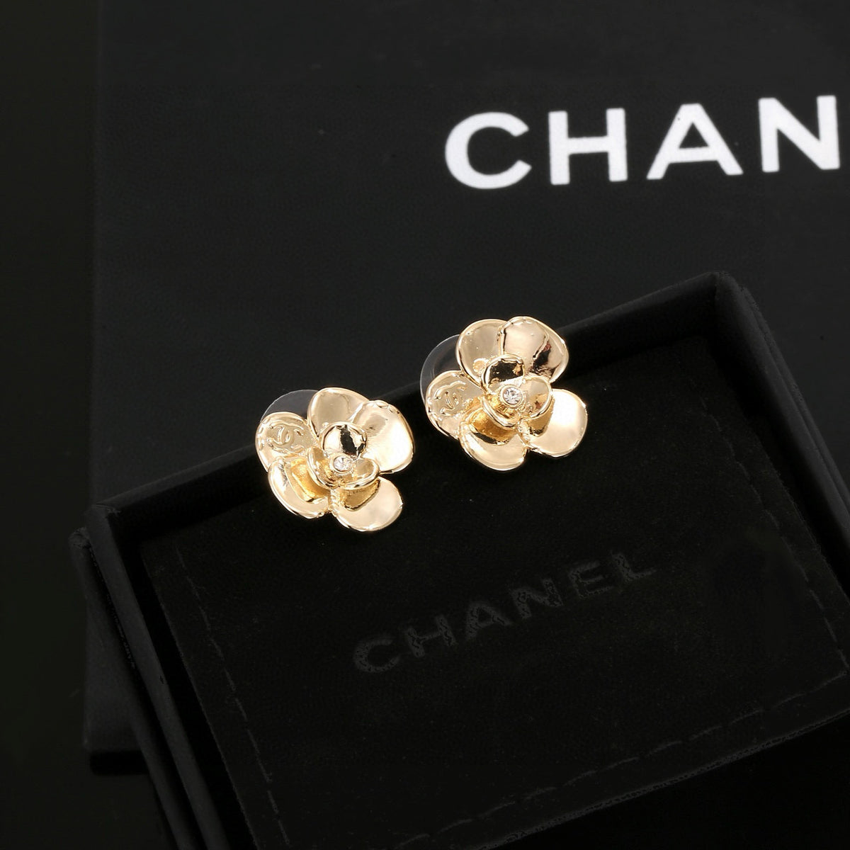 Chanel Interlocking C Camellia Resin Gold-Tone Stud Earrings - album image 1