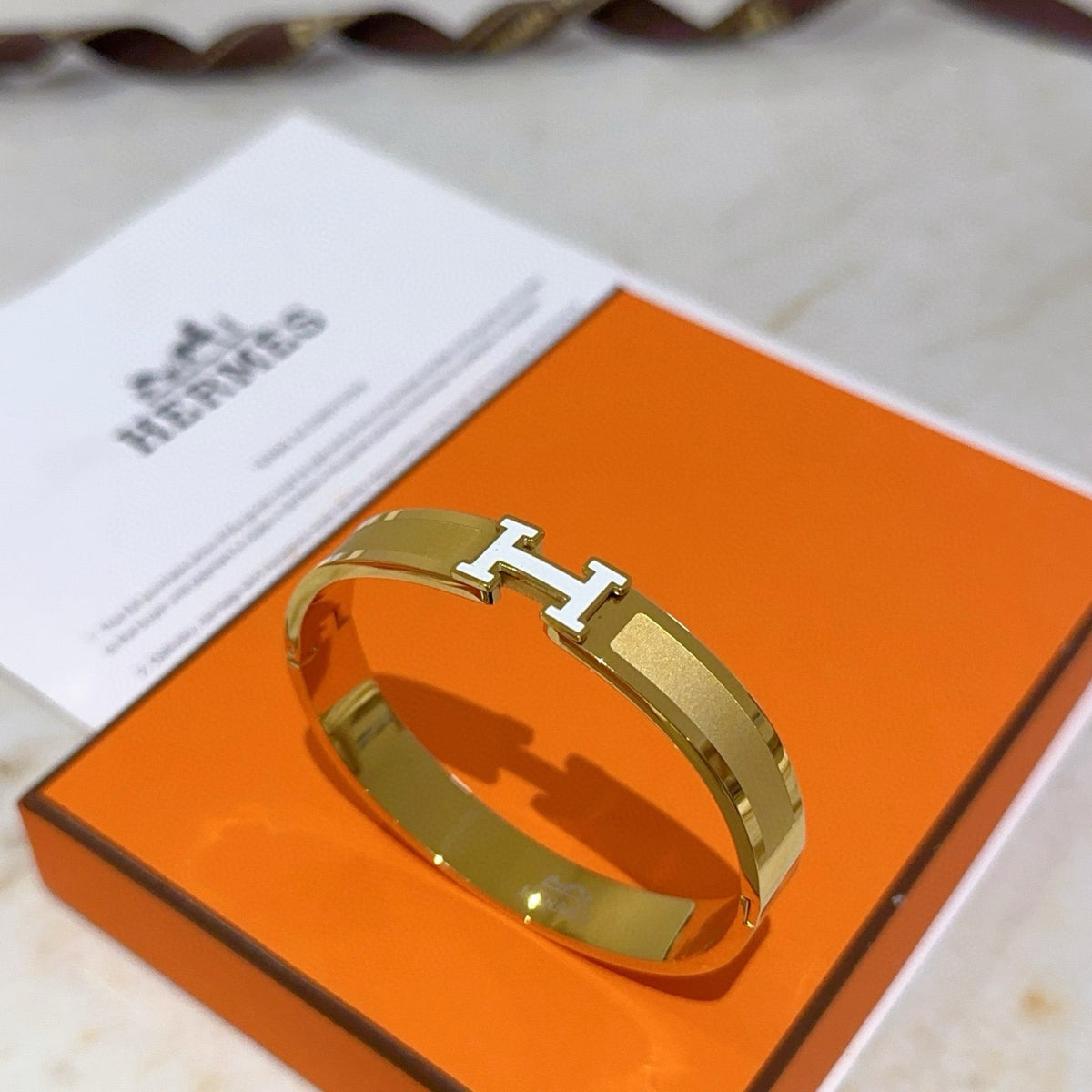 Hermès White Leather Gold-Tone H Bracelet - album image 7