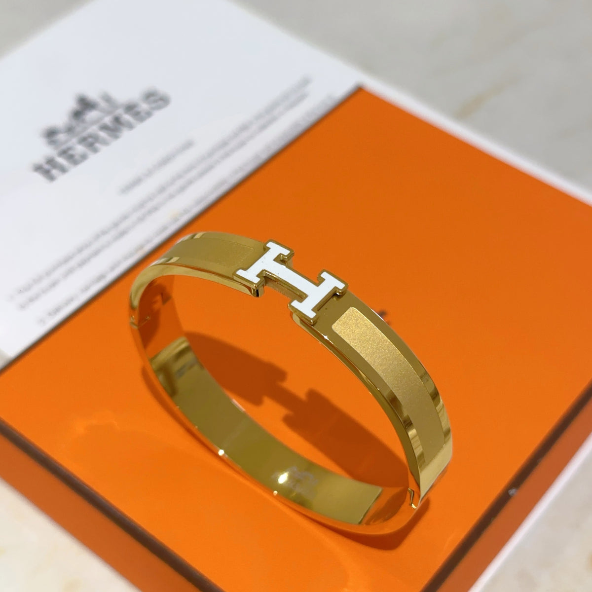 Hermès White Leather Gold-Tone H Bracelet - album image 2