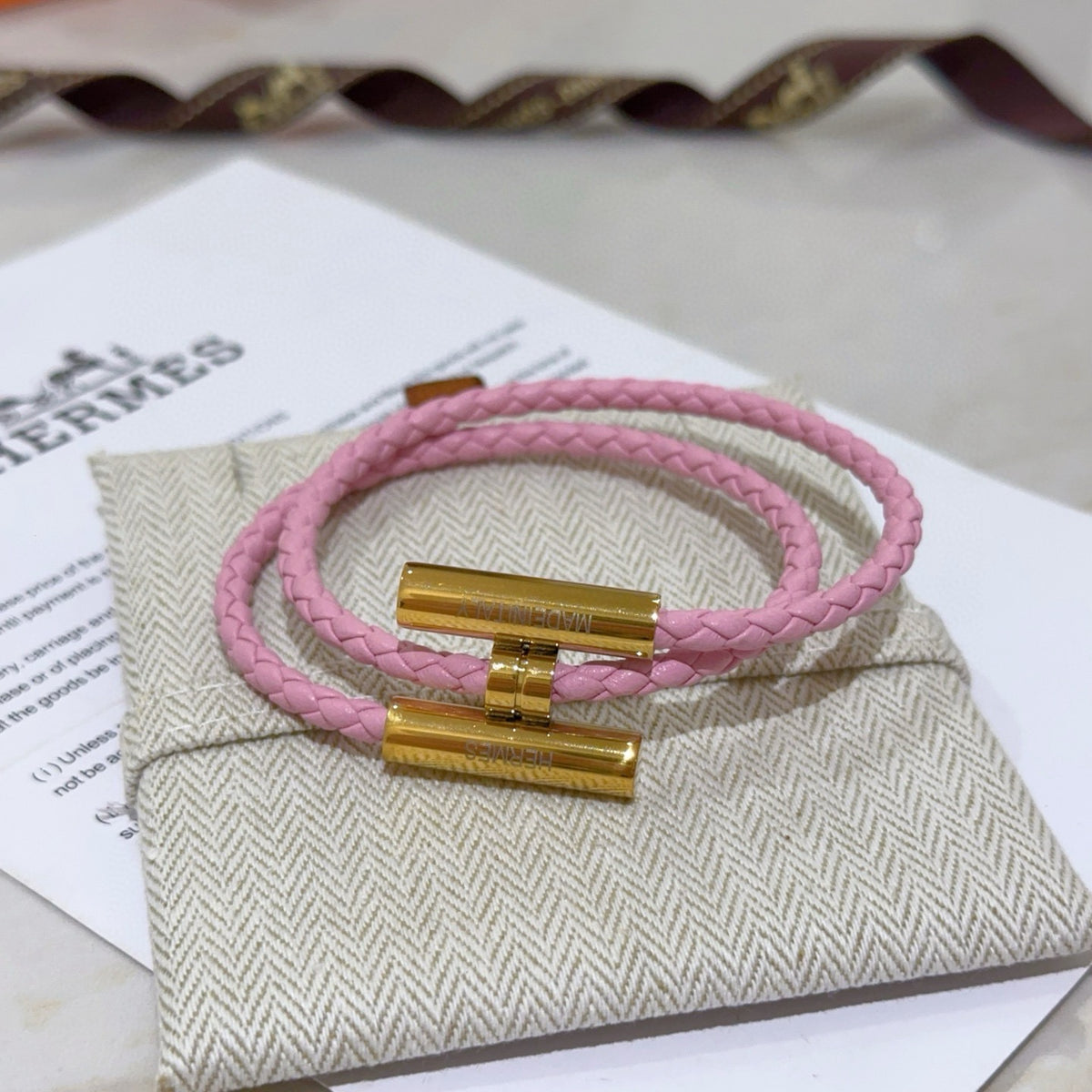 Hermès Pink Braided Gold-Tone H Bracelet - album image 1