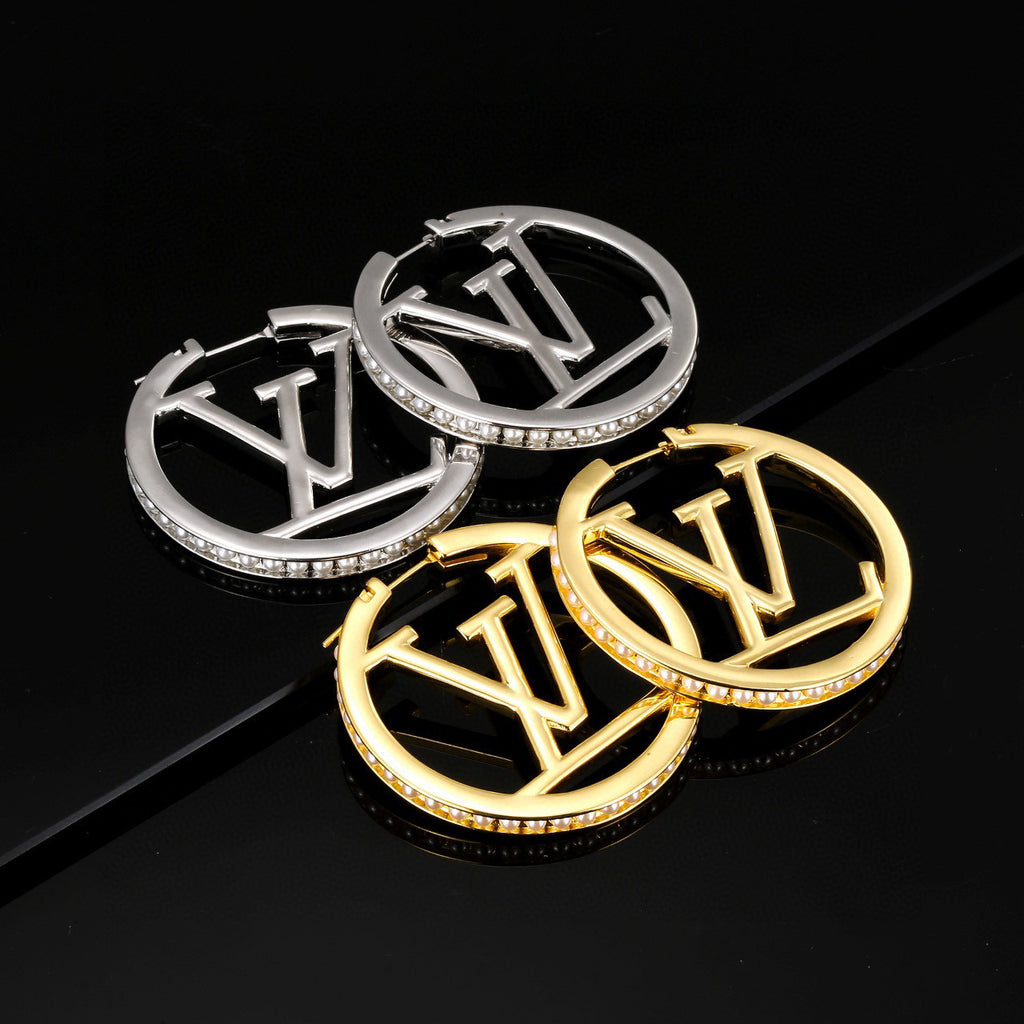 Louis Vuitton LV Letter Stud Earrings - album image 1