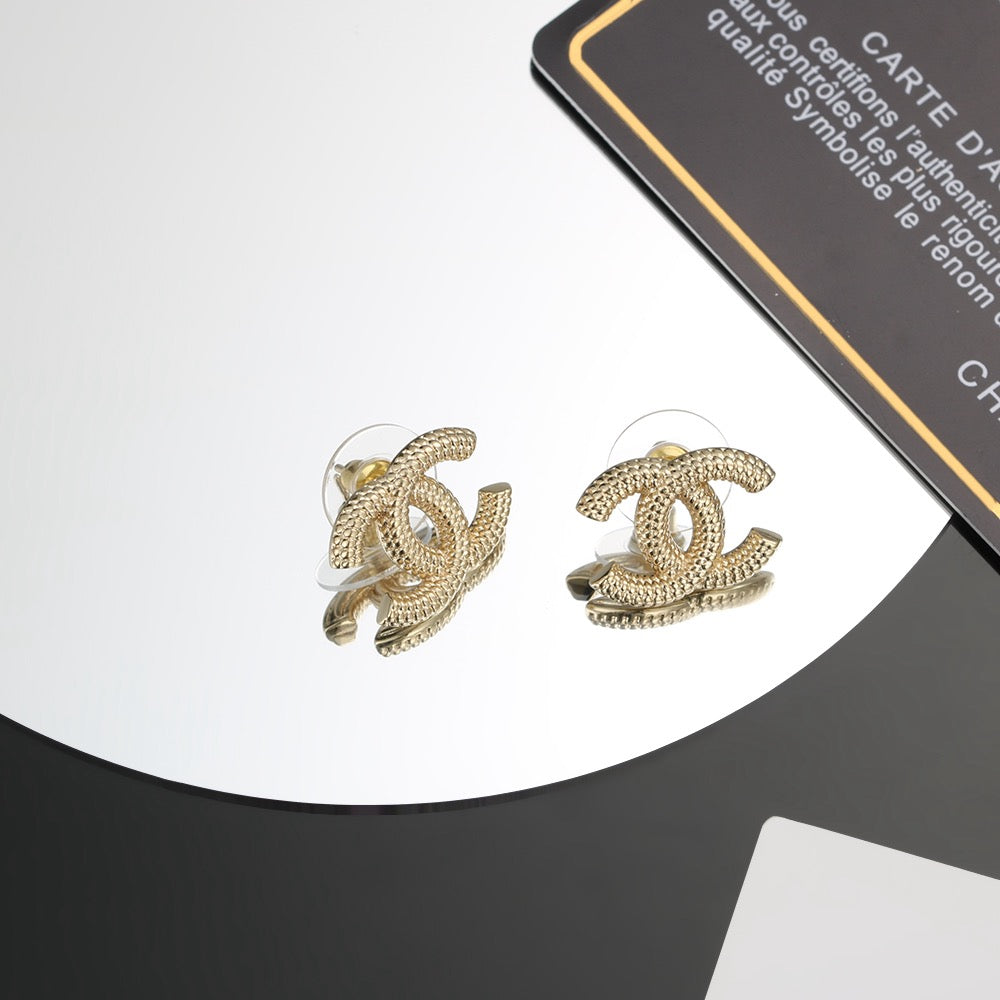 Chanel Gold-Tone Sculptural CC Stud Earrings - album image 1