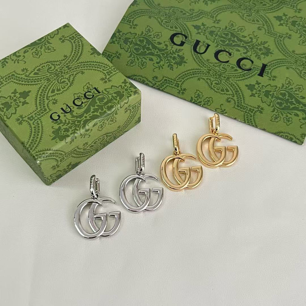 Gucci Interlocking G Drop Earrings in Gold and Silver Tones - album image 2