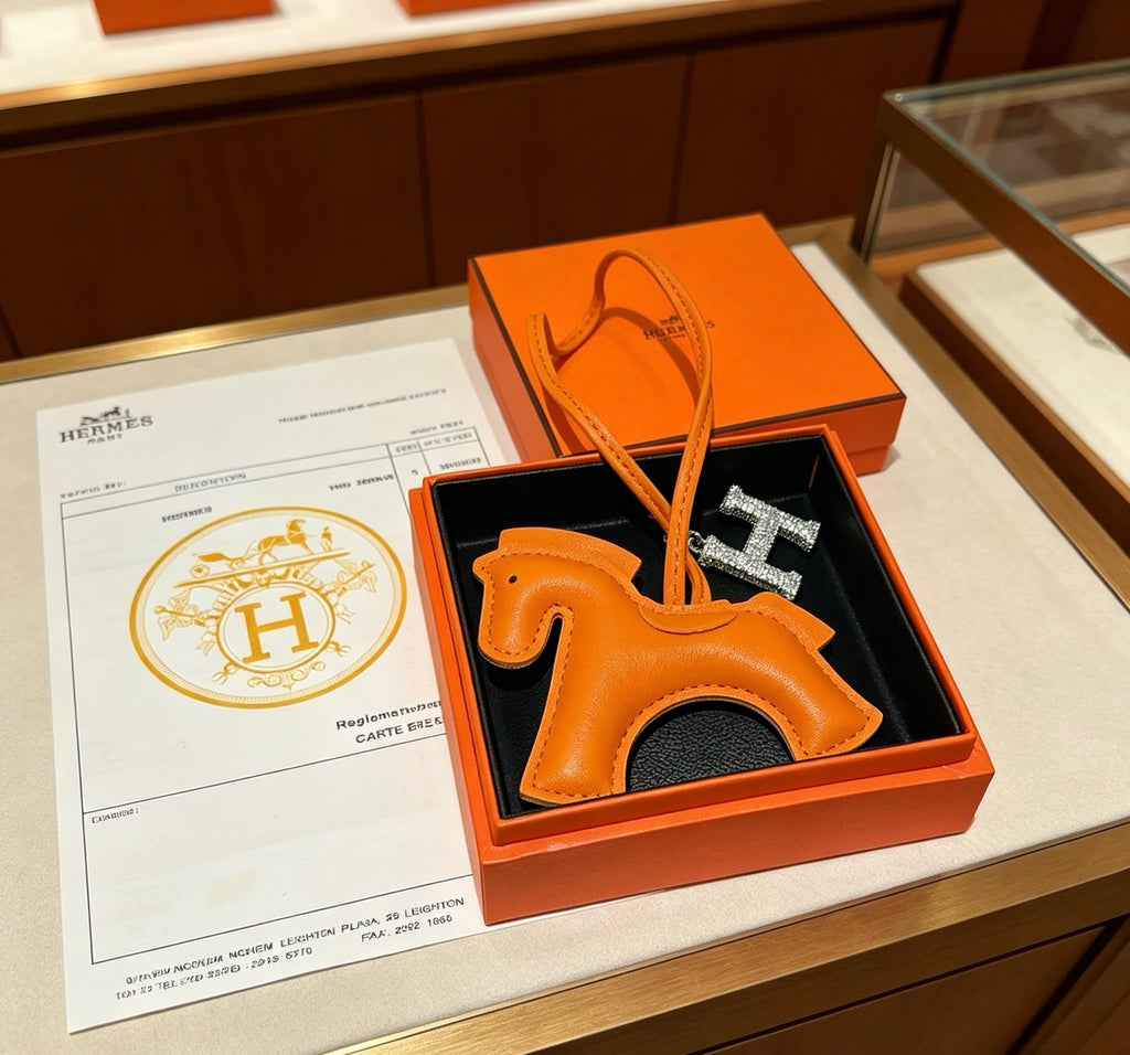 Hermès Orange Leather Horse Bag Charm - album image 1