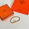 Hermès Gold-Tone Braided Bracelet - album image 1