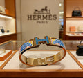 Hermès Gold-Tone Blue Printed H-Clasp Bangle - album image 1