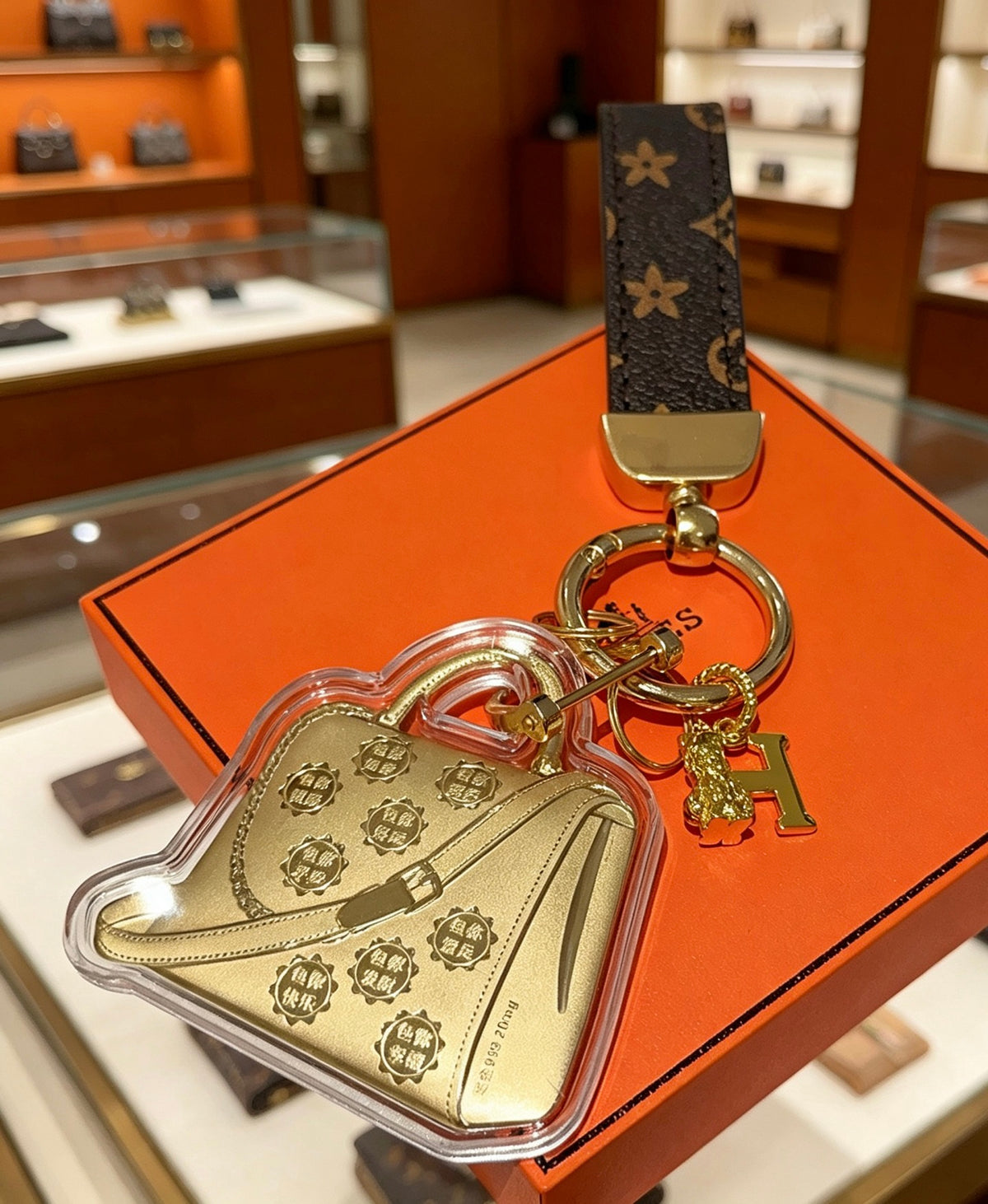Hermès Gold-Tone Handbag-Charm Keychain with Black Strap - album image 2