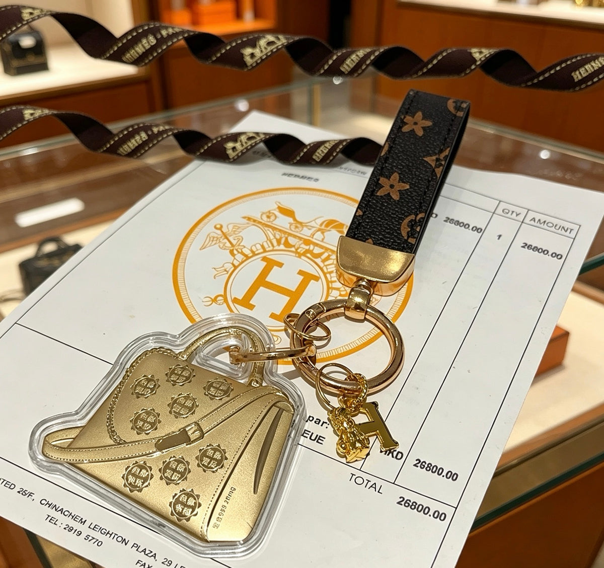 Hermès Gold-Tone Handbag-Charm Keychain with Black Strap - album image 4