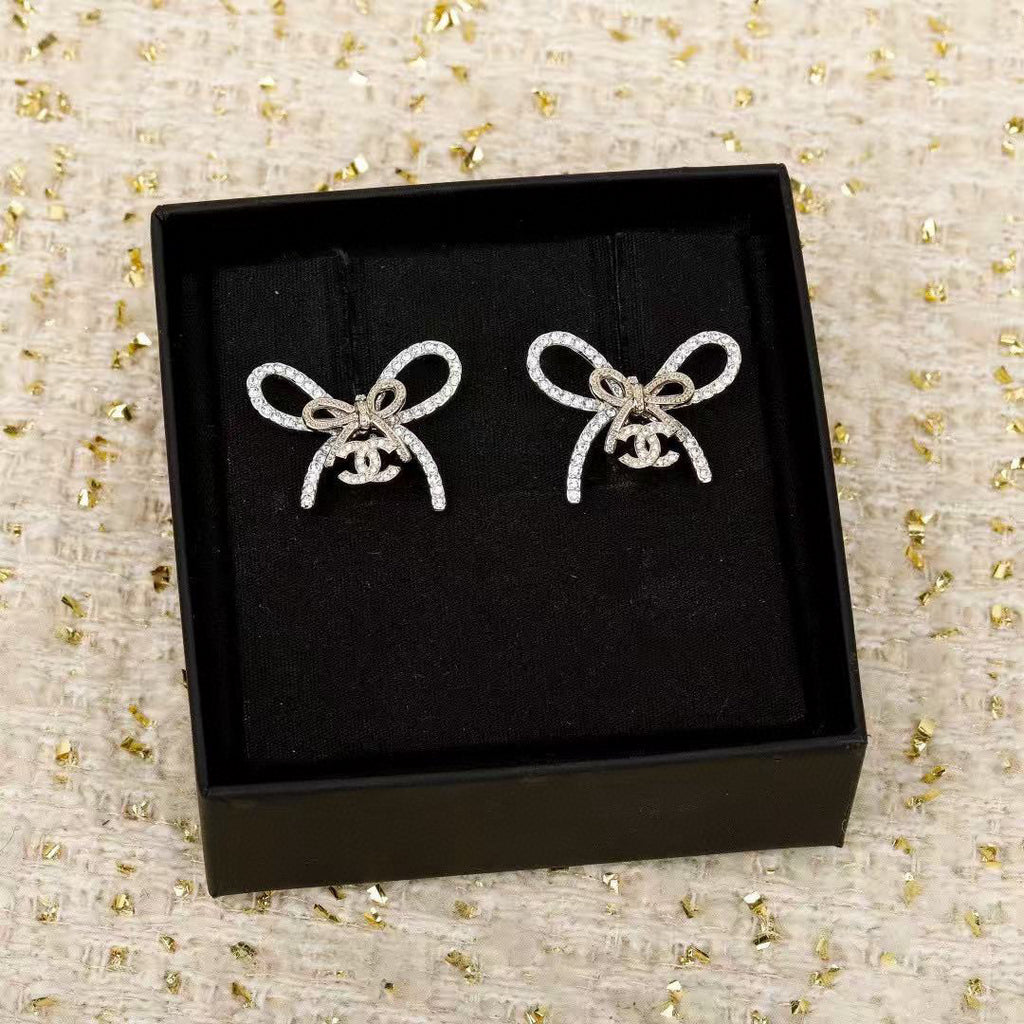Chanel Interlocking C Bow Butterfly Earrings - album image 6