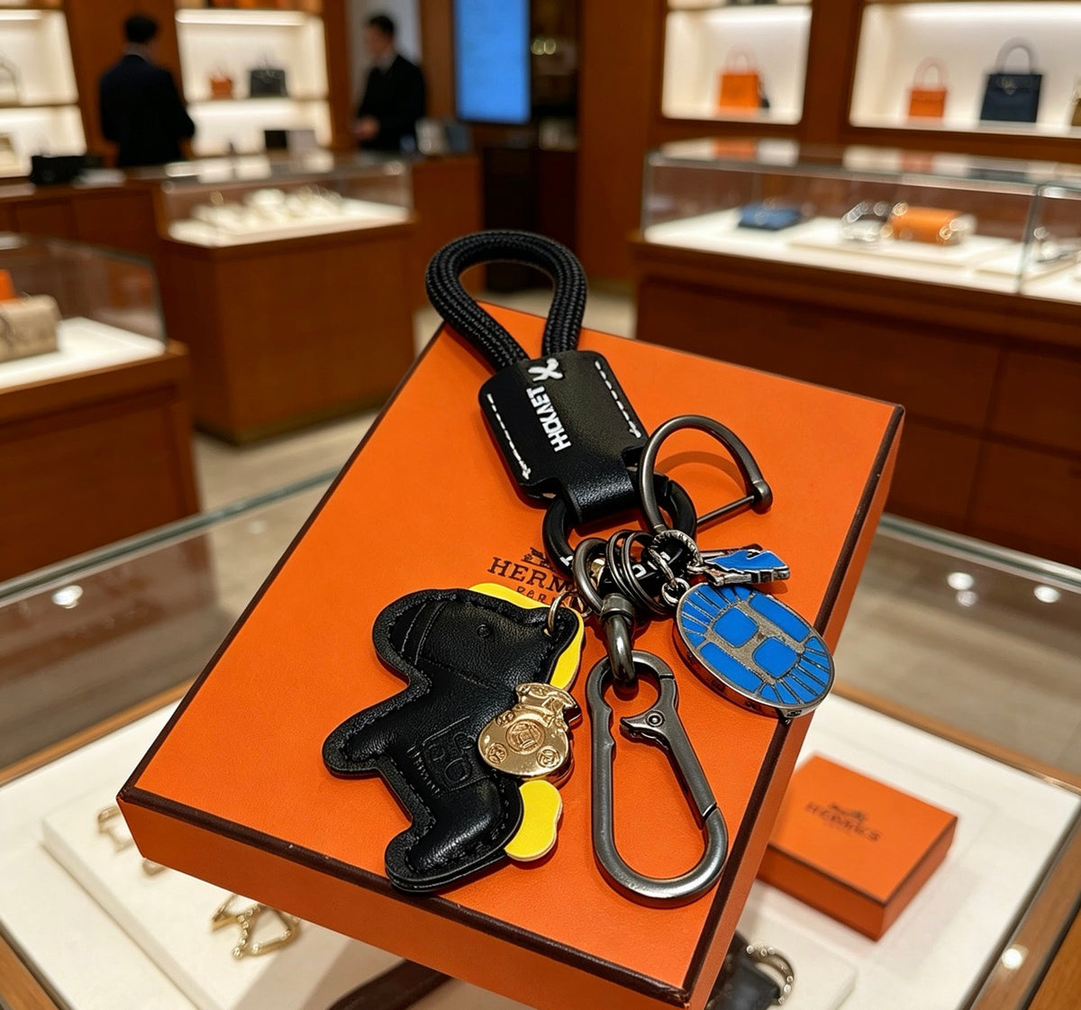 Hermès Black Horse Keychain with Black Braided Cord - album image 1