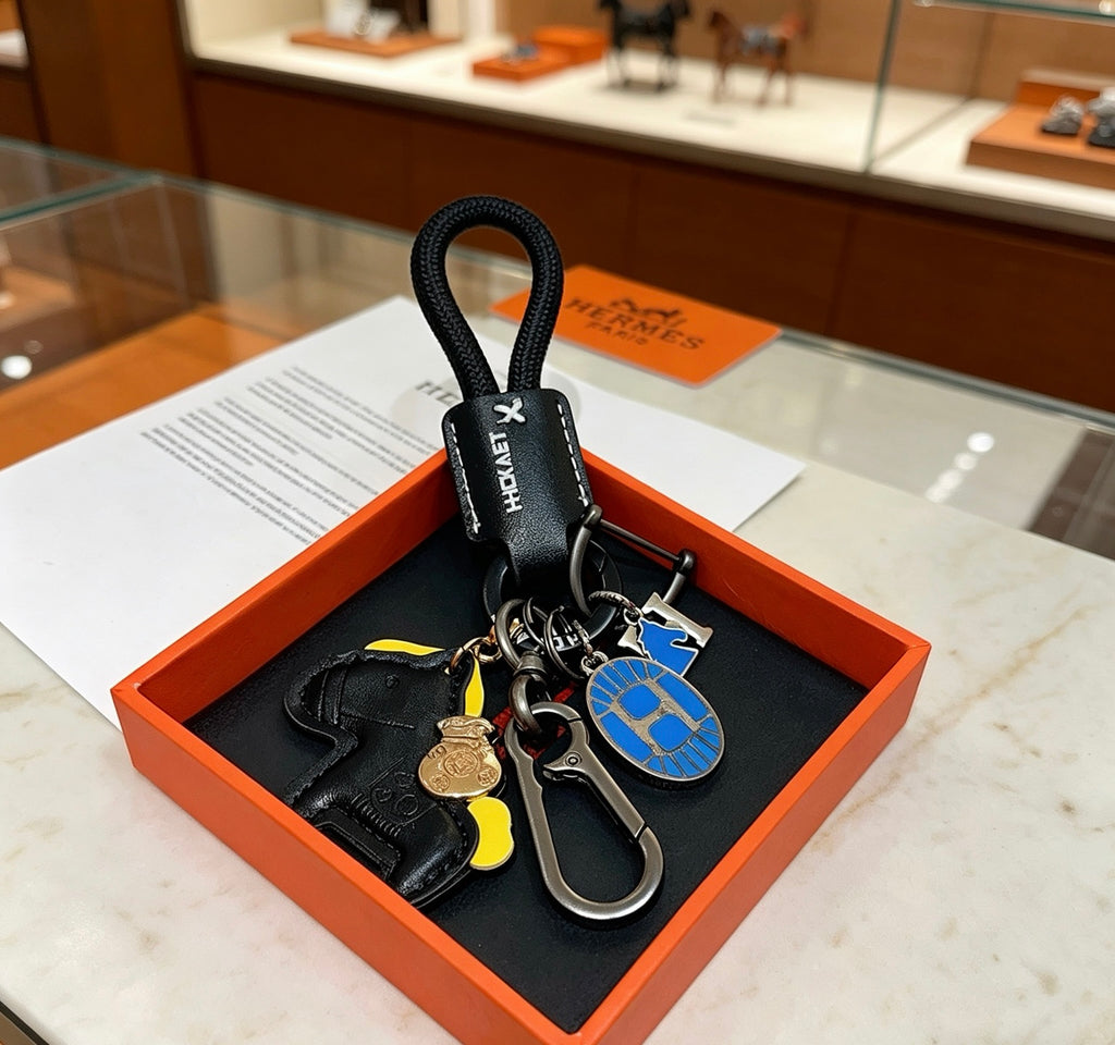Hermès Black Horse Keychain with Black Braided Cord - album image 6