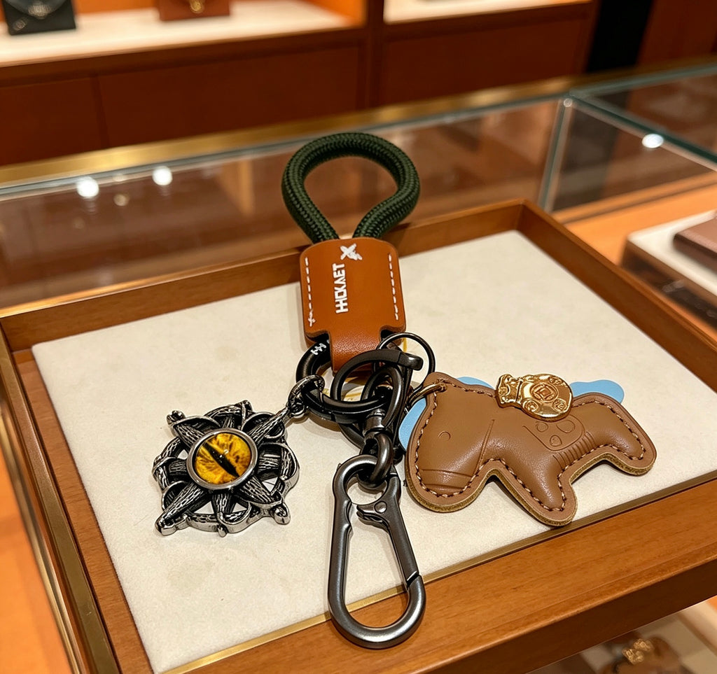 Hermès Tan Horse Keychain with Black Braided Cord - album image 5