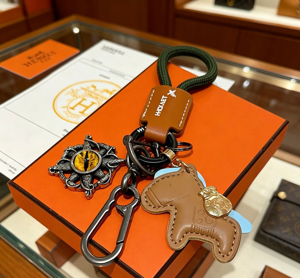 Hermès Tan Horse Keychain with Black Braided Cord - album image 4
