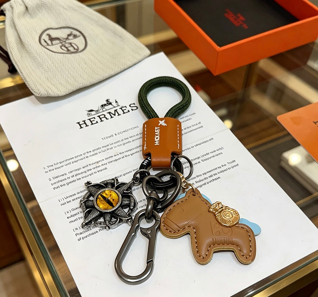 Hermès Tan Horse Keychain with Black Braided Cord - album image 3
