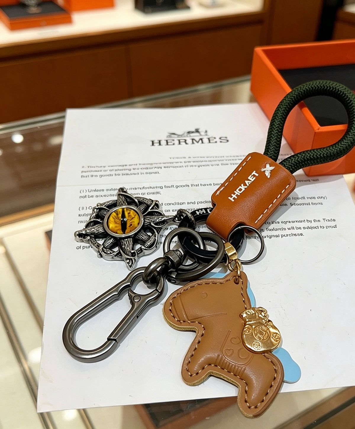 Hermès Tan Horse Keychain with Black Braided Cord - album image 6
