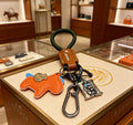 Hermès Orange Horse Keychain with Brown Strap - album image 1