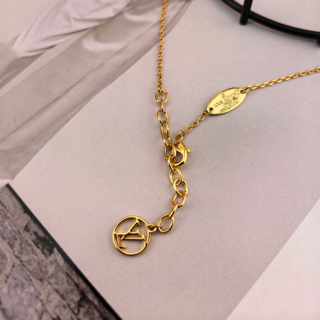 Louis Vuitton Gold-Tone Circular Pendant Necklace - album image 9