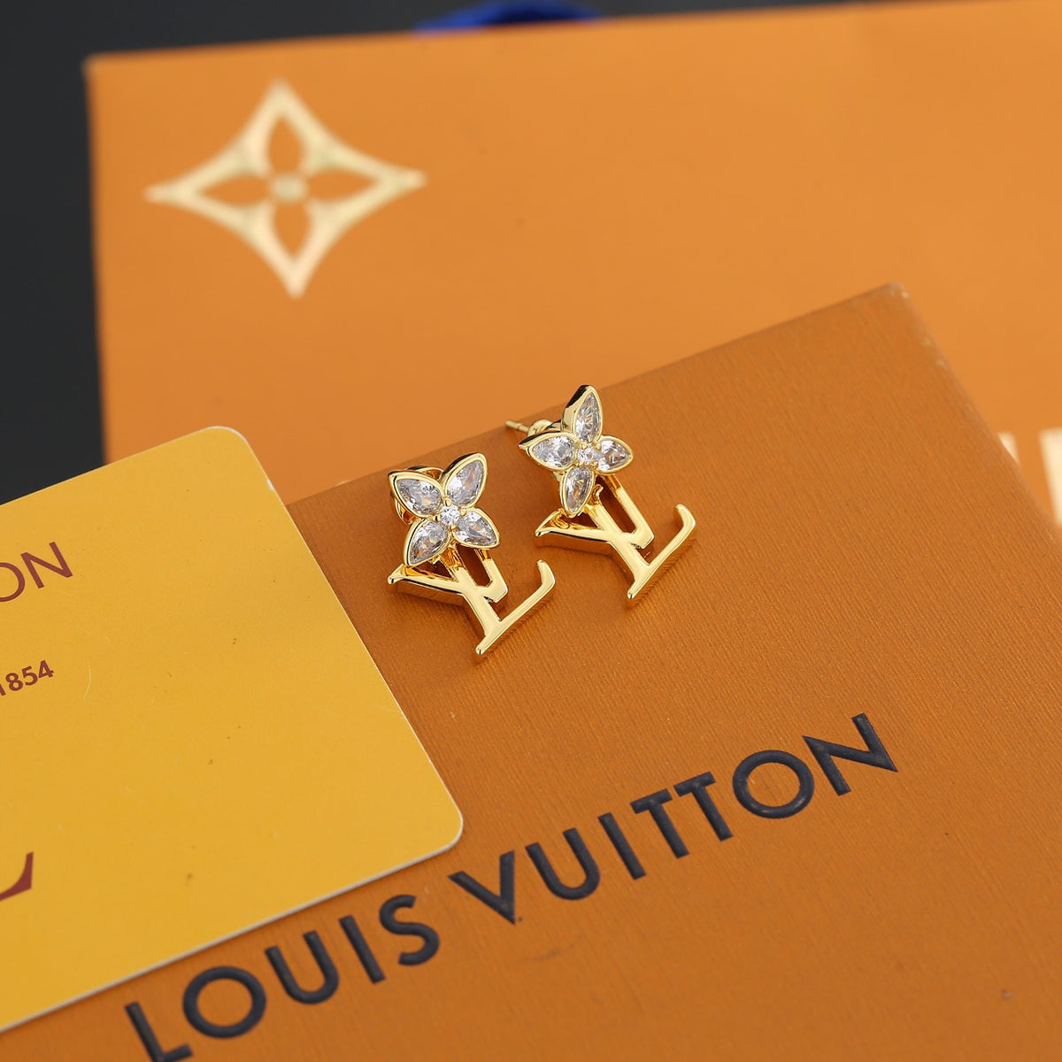 Louis Vuitton Gold-Tone LV and Flower Stud Earrings - album image 1