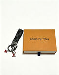 Louis Vuitton Black Strap Keychain with Red Flower Accent - album image 1