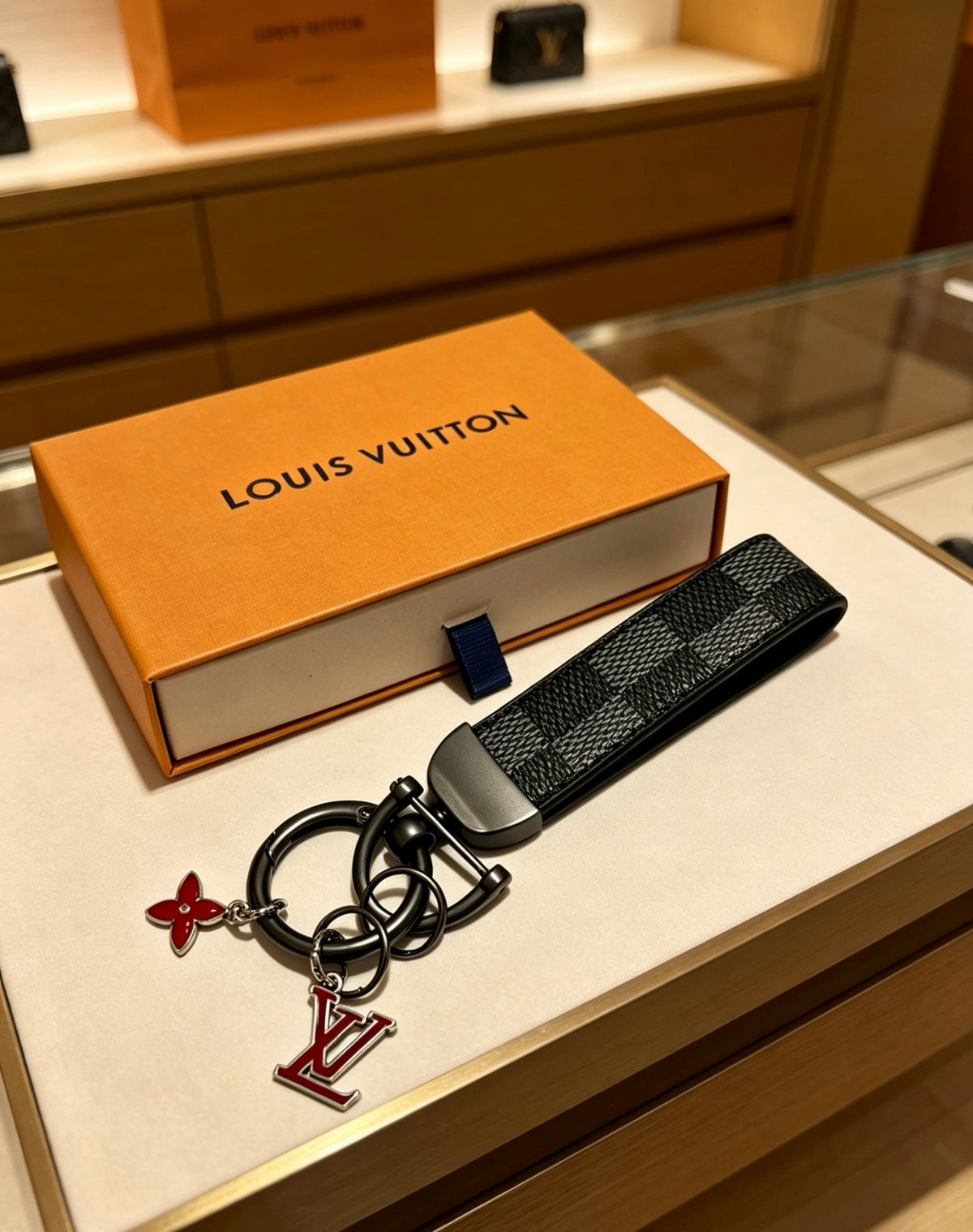 Louis Vuitton Black Strap Keychain with Red Flower Accent - album image 6