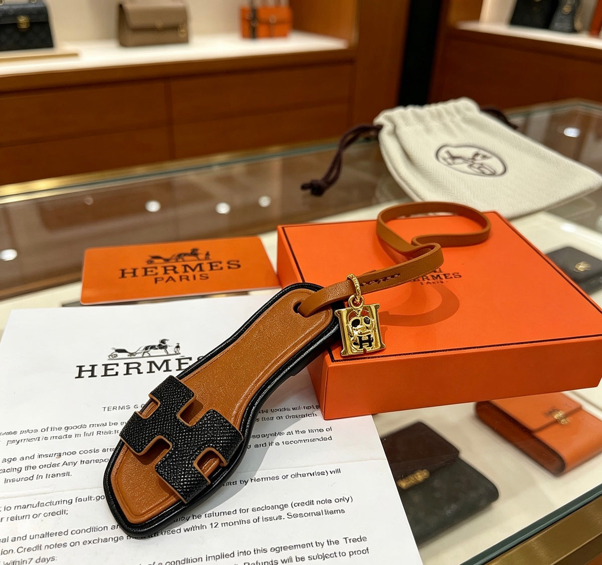 Hermès Black and Tan Leather H Bracelet - album image 1