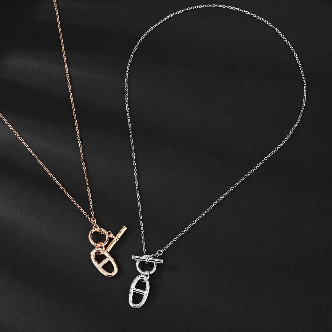 Hermès Silver and Rose Gold-Tone Sculptural Pendant Necklace - album image 1