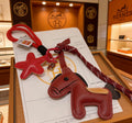 Hermès Red and Tan Layered Leather Horse Bag Charm - album image 1