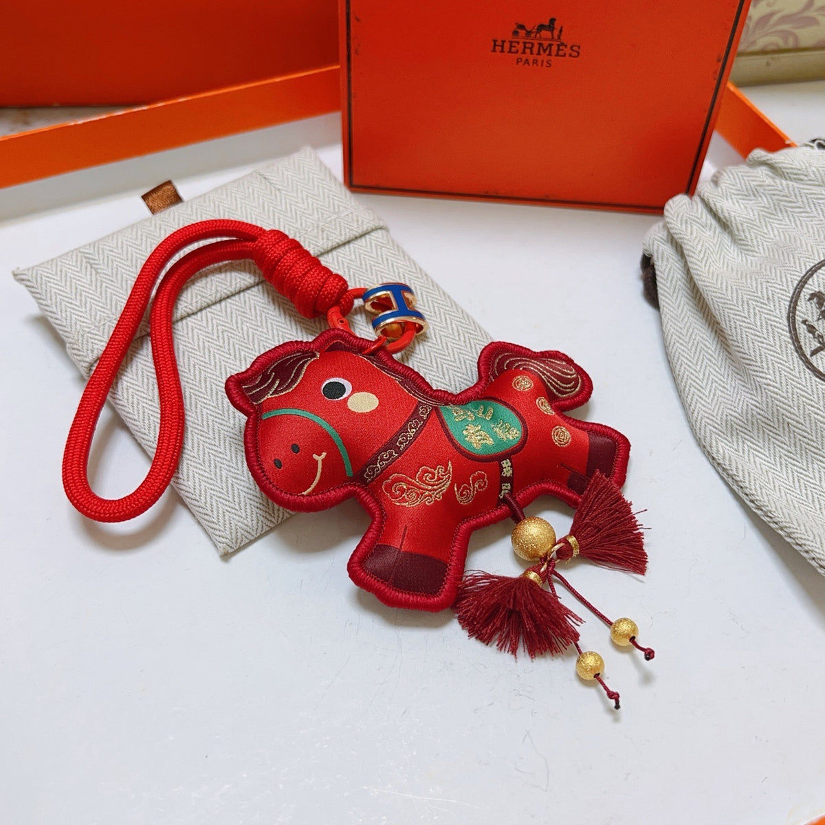 Hermès Red Flower-Charm Keychain with Red Braided Cord - album image 6