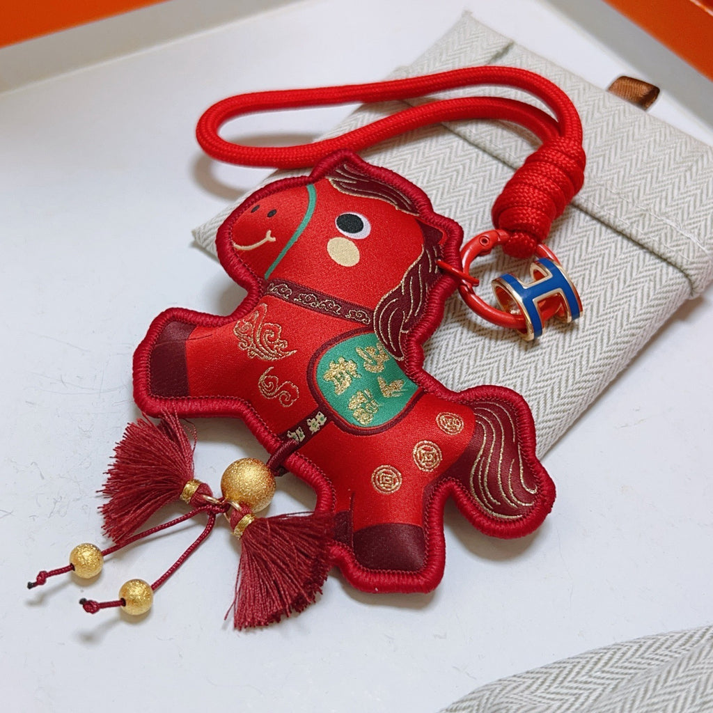 Hermès Red Flower-Charm Keychain with Red Braided Cord - album image 2