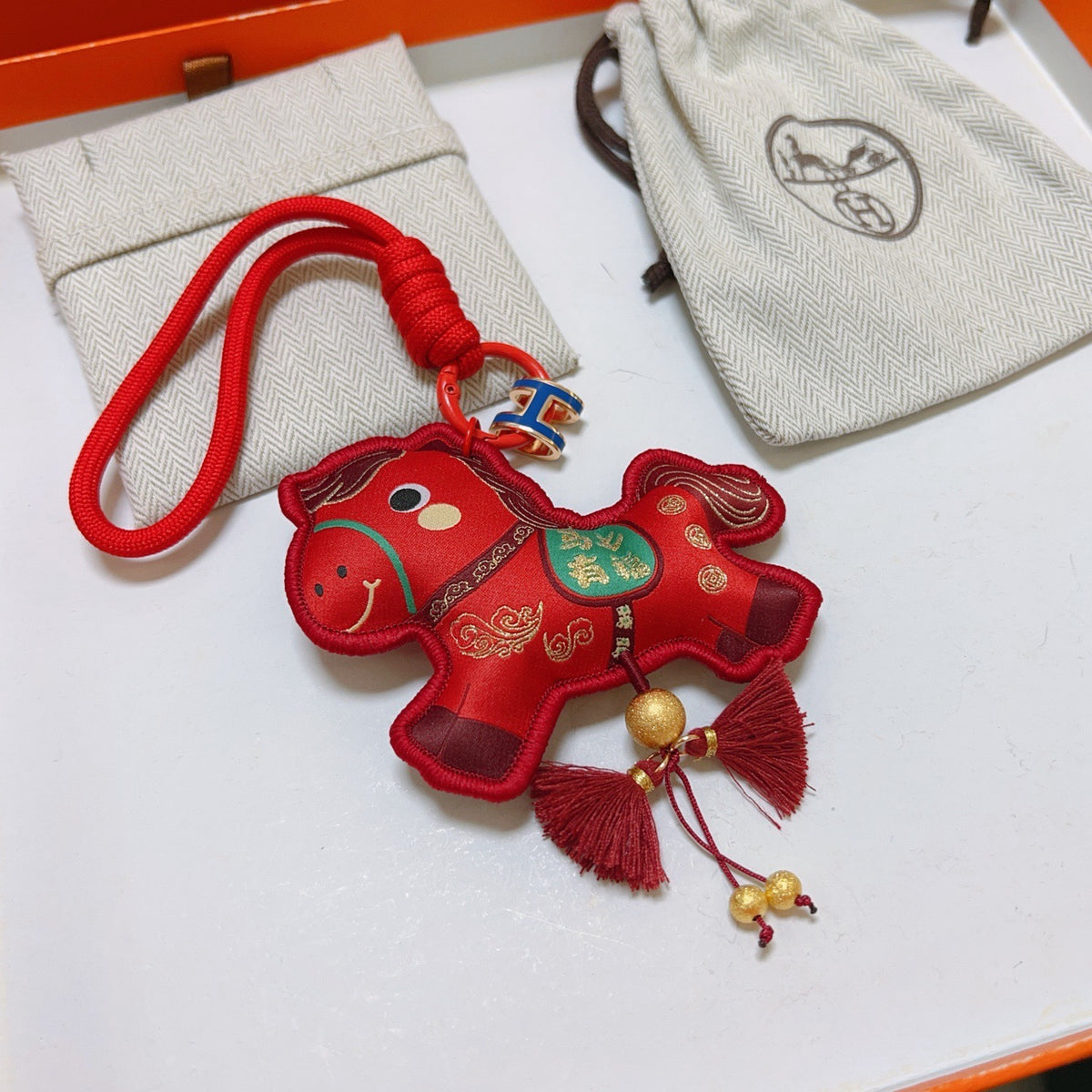 Hermès Red Flower-Charm Keychain with Red Braided Cord - album image 4