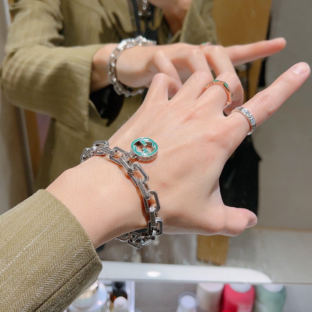 Gucci Silver-Tone Oval Link Bracelet with Blue Circular Charm - album image 9