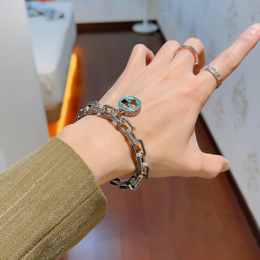 Gucci Silver-Tone Oval Link Bracelet with Blue Circular Charm - album image 6