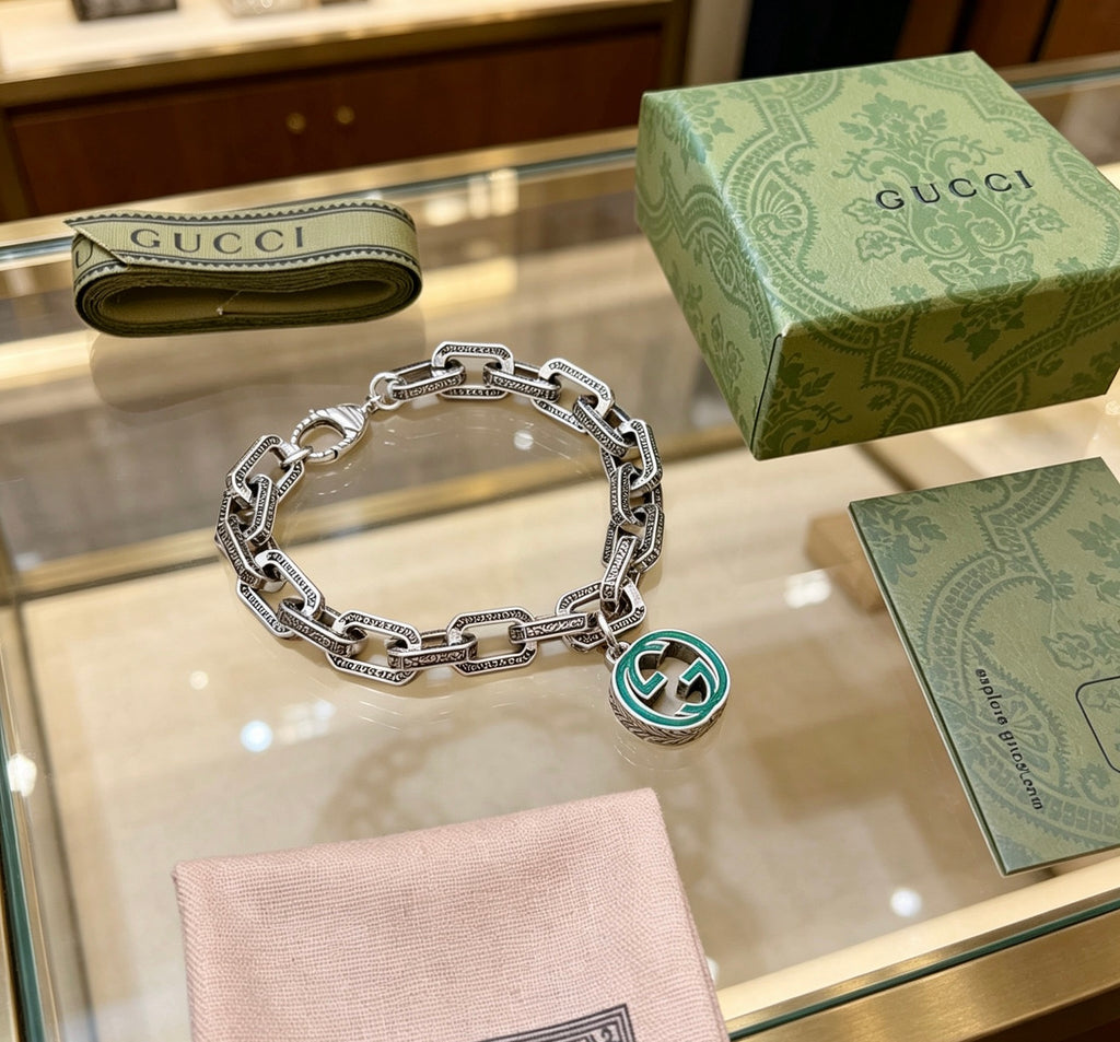 Gucci Silver-Tone Oval Link Bracelet with Blue Circular Charm - album image 8