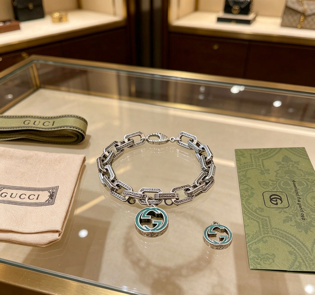 Gucci Silver-Tone Oval Link Bracelet with Blue Circular Charm - album image 7