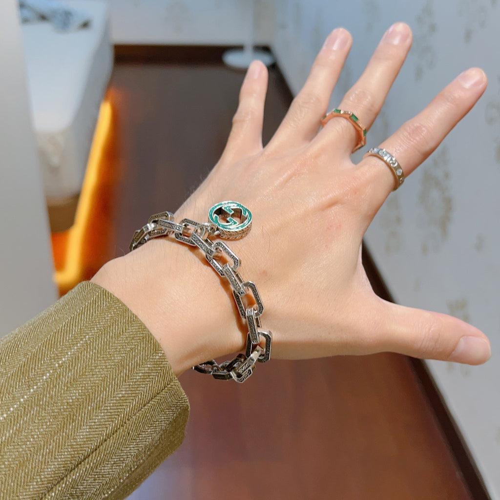 Gucci Silver-Tone Oval Link Bracelet with Blue Circular Charm - album image 3