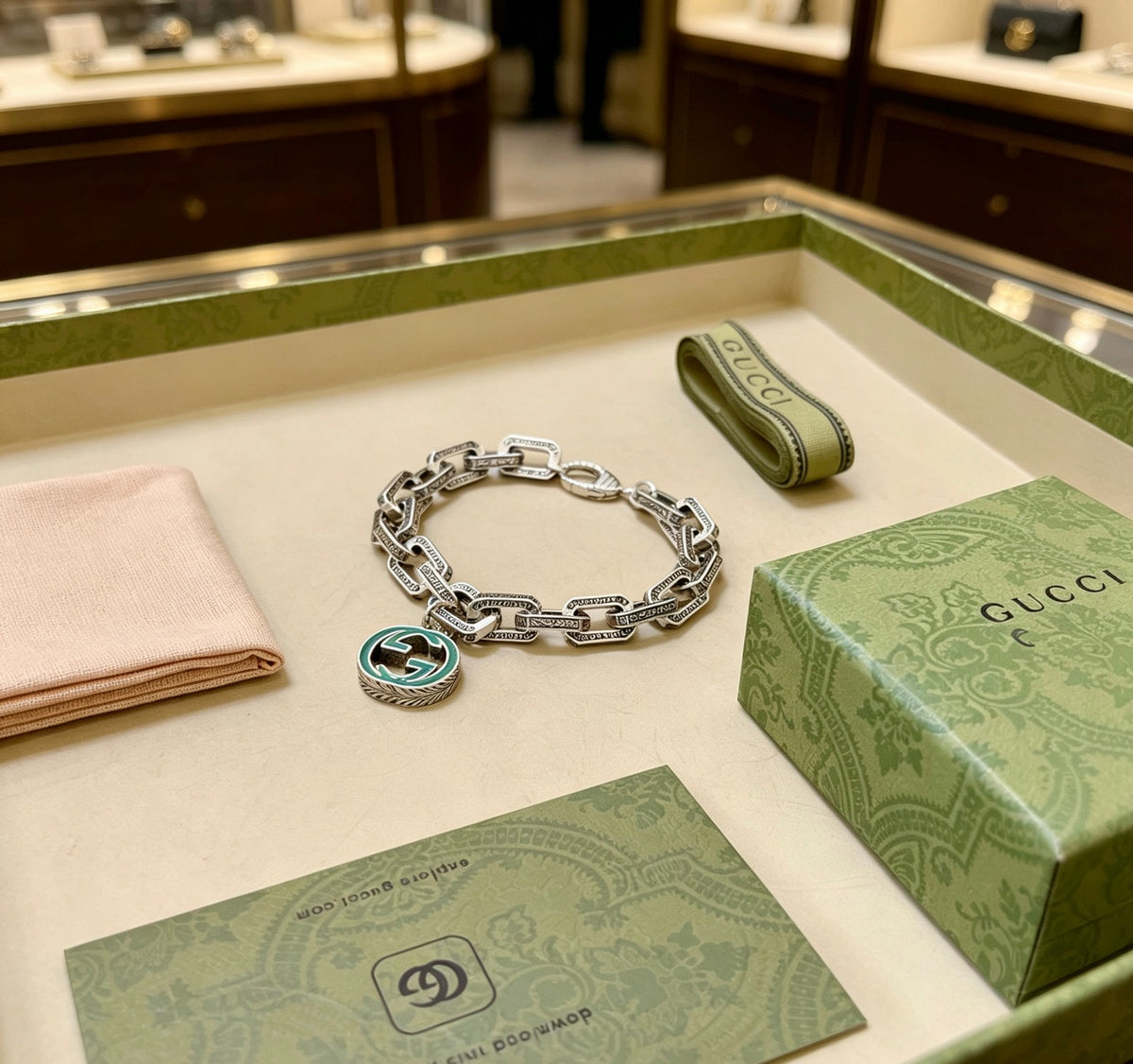 Gucci Silver-Tone Oval Link Bracelet with Blue Circular Charm - album image 2