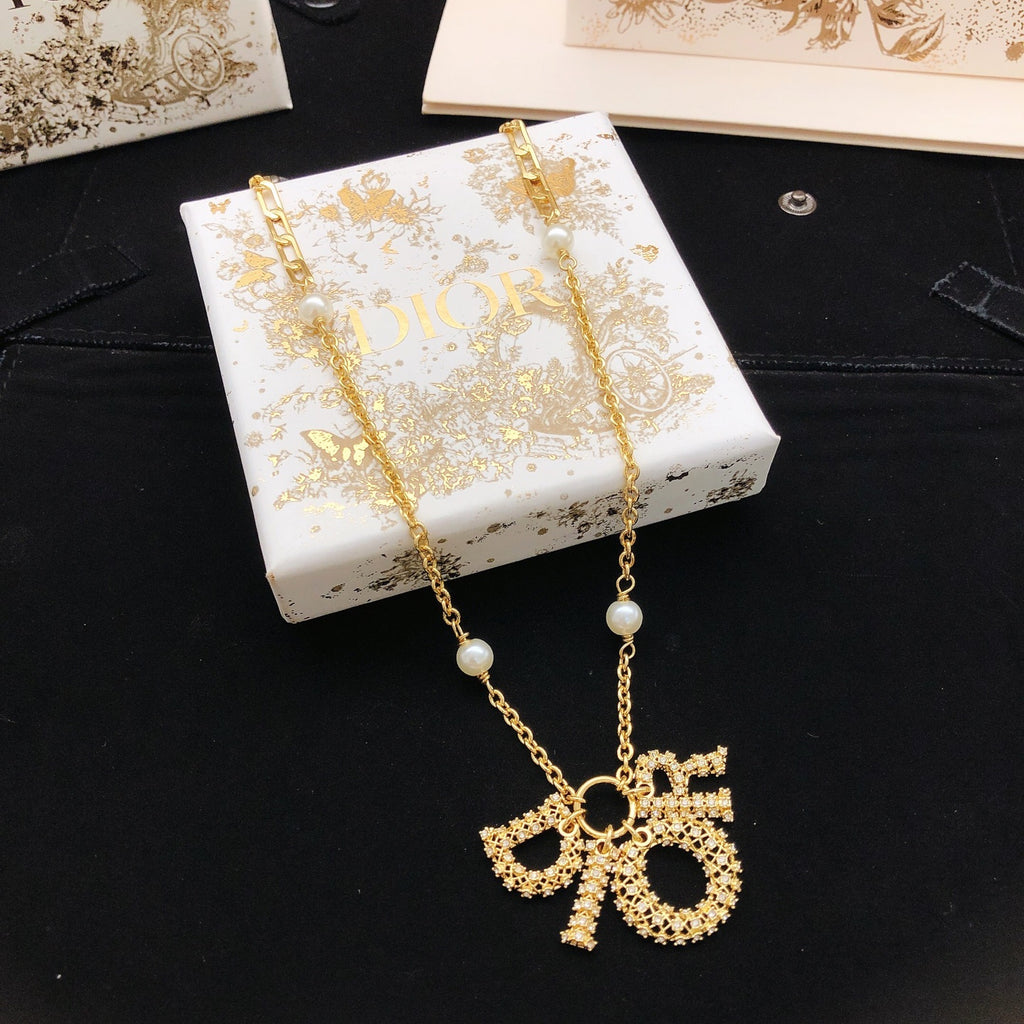 Dior Asymmetric Bow and Round Pendant Necklace - product image 1