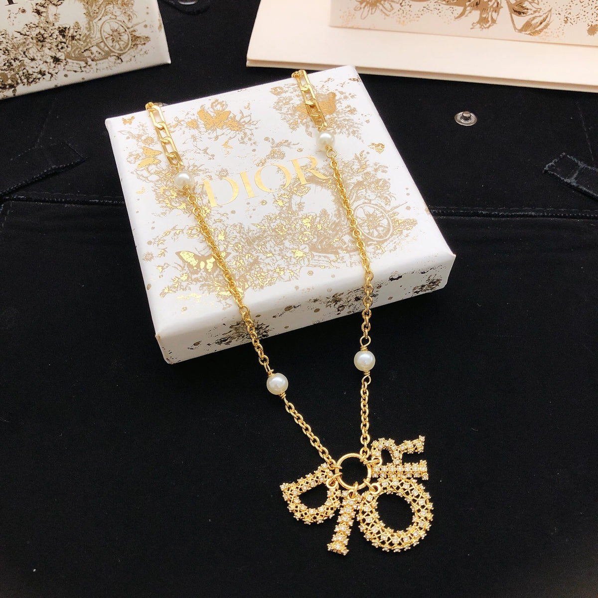 Dior Asymmetric Bow and Round Pendant Necklace - product image 1