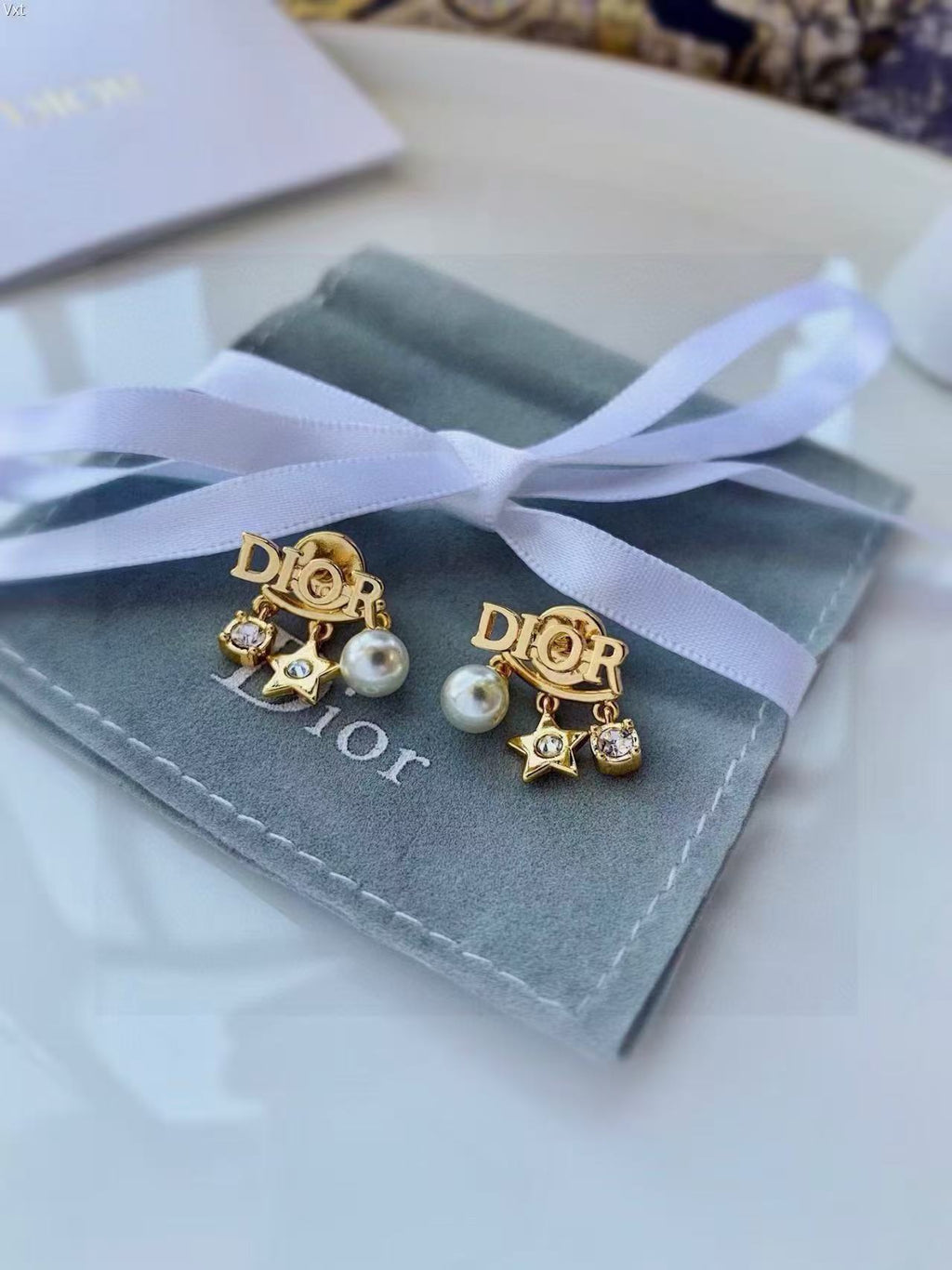 Dior Asymmetric Medallion Stud Earrings - product image 1