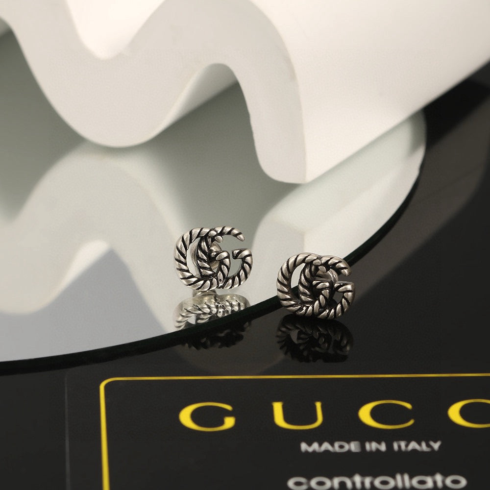 Gucci Dark Silver-Tone Textured GG Stud Earrings - album image 1