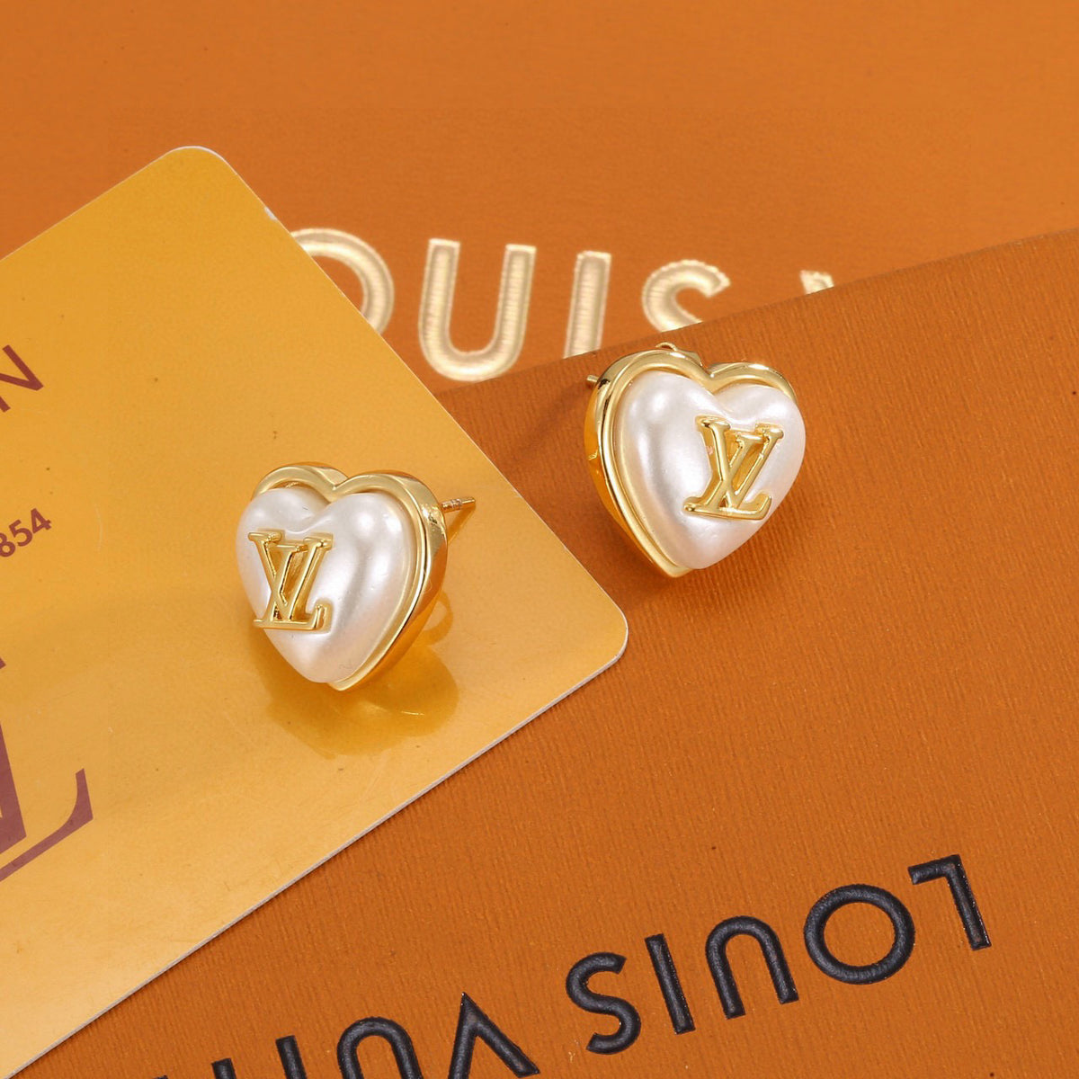 Louis Vuitton Heart LV Letter Stud Earrings - album image 1