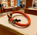 Hermès Orange Braided Leather Silver-Tone Bar Bracelet - album image 1