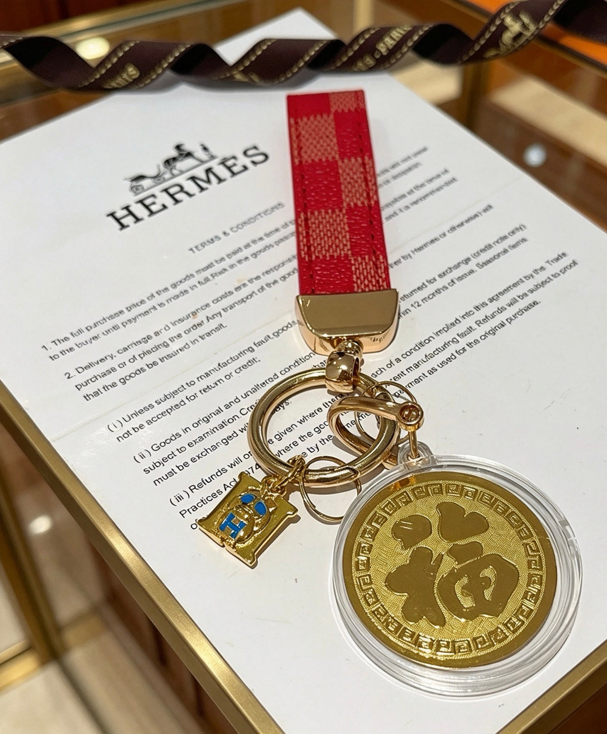 Hermès Gold-Tone H Medallion Keychain with Brown Strap - album image 9