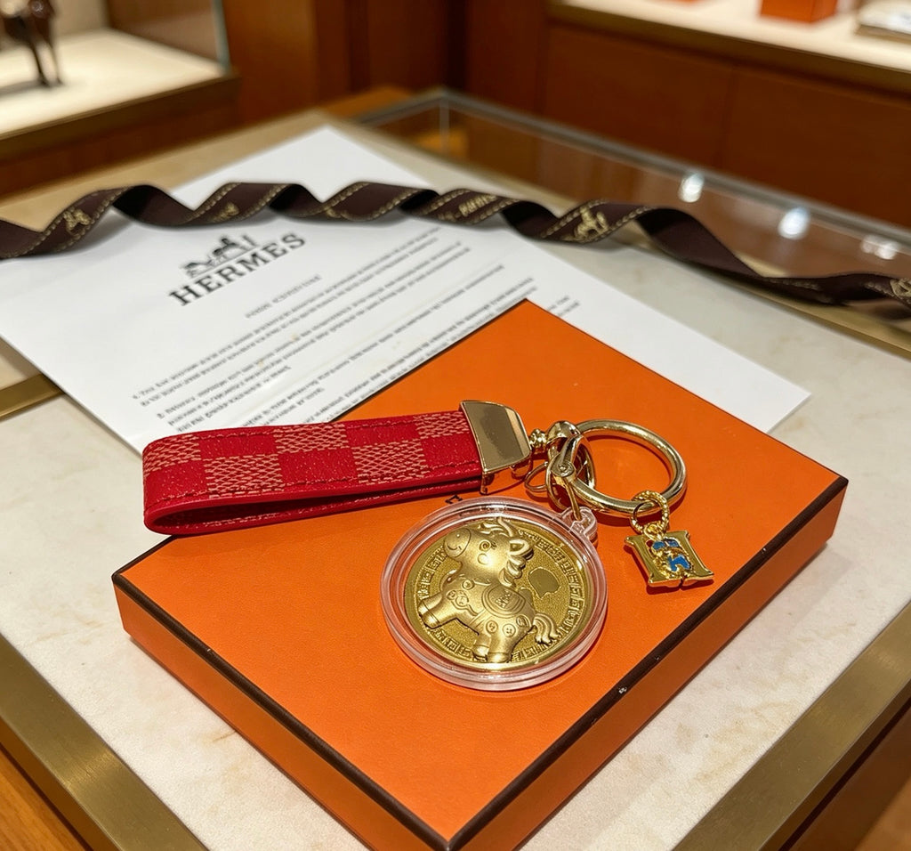 Hermès Gold-Tone H Medallion Keychain with Brown Strap - album image 7