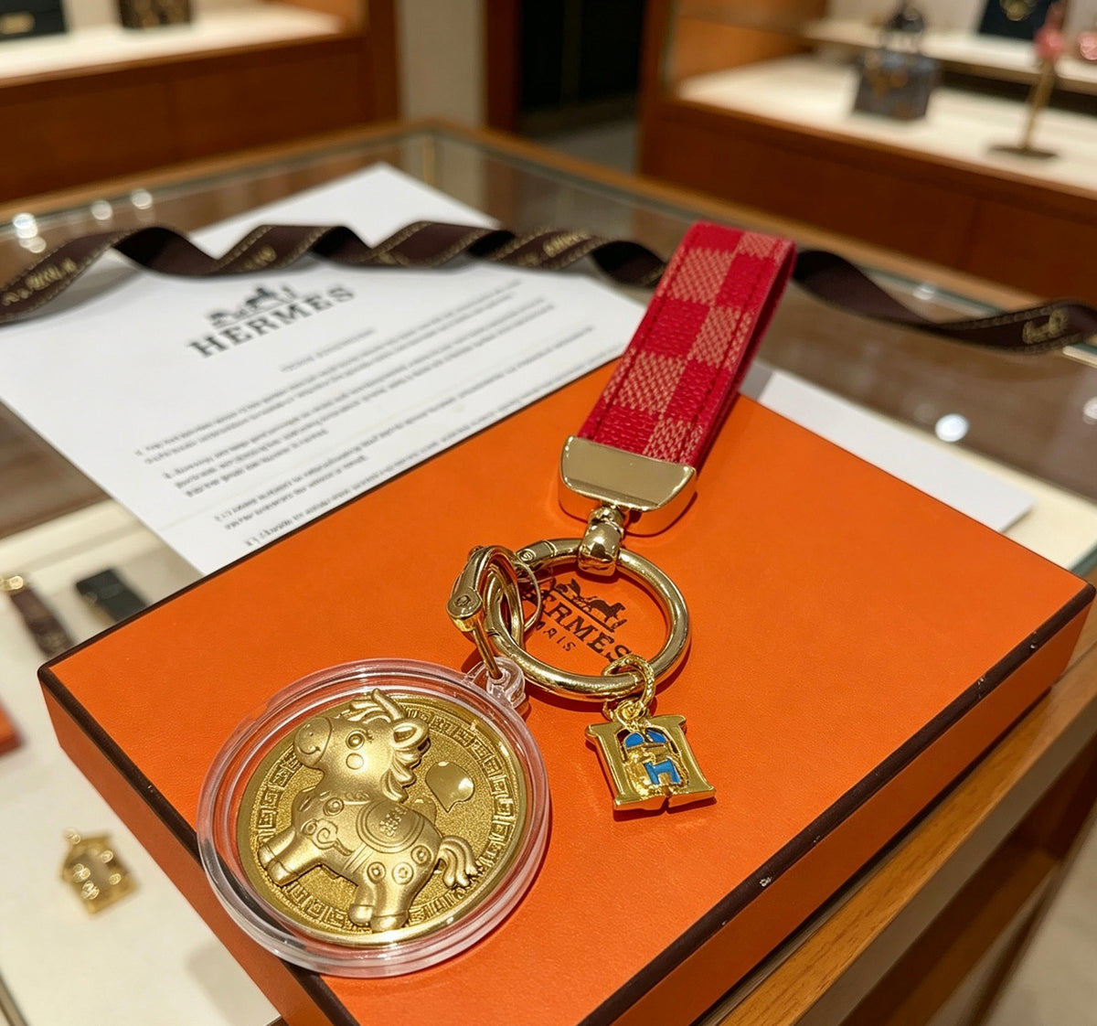 Hermès Gold-Tone H Medallion Keychain with Brown Strap - album image 5