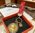 Hermès Gold-Tone H Medallion Keychain with Brown Strap - album image 1