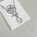 Hermès Silver-Tone H Disc and Horse-Outline Pendant Necklace - album image 1